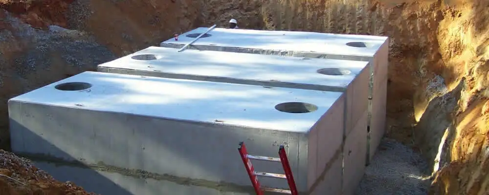 Septic tank installation site with a newly placed concrete tank in Fort Worth, TX